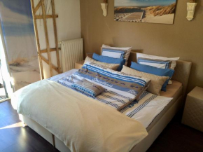 Christinas Strandhus mit Balkon und Strandkorb und Parkplatz